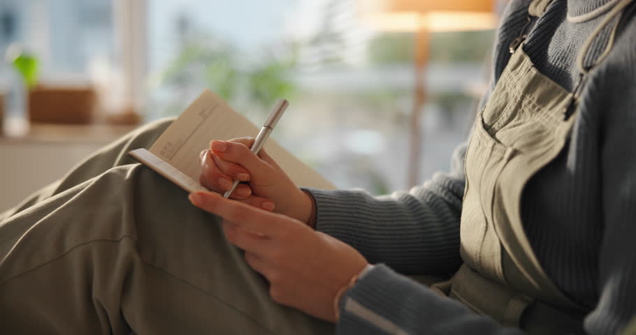Relax, thinking and writing with hands of person in home for agenda, calendar or schedule planning. Ideas, notebook and pen with woman in apartment for to do list in diary, journal or planner