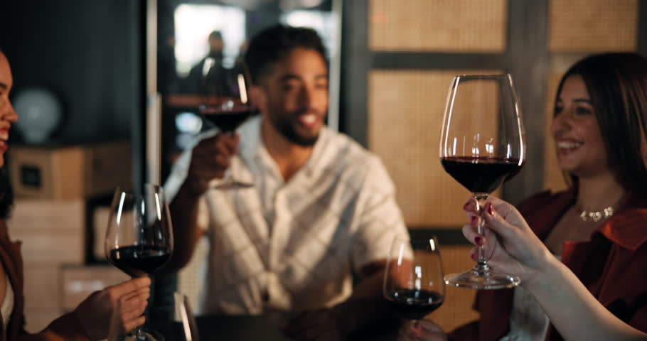 Celebration, hands and toast with friends in restaurant together for dinner party or social event. Cheers, milestone and wine with group of happy people drinking alcohol for nightlife entertainment