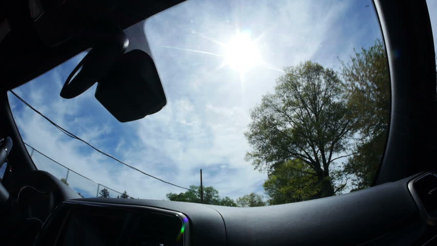 Extreme fish eye view of looking through the front windshield while driving.