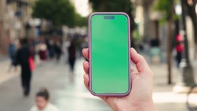Woman on Street Using Phone with Green Screen Chroma Key. High quality 4k footage - Powered by Shutterstock - Get 15% off with code: PIKWIZARD15