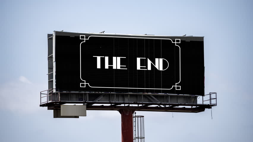 large outdoor advertising board with cinematic titles the end on the screen 
