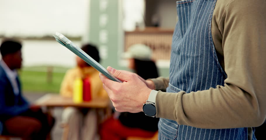 Man, hands and waiter with tablet by food truck for sales, order stock or inventory in nature. Barista, person and technology at outdoor cafe to review menu, scroll email or schedule for hospitality