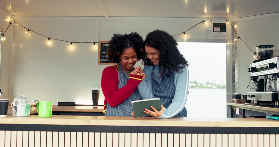 Happy women, barista and tablet with high five for congratulations, food truck and trailer cafe. People, tech and waiter for customer service, partnership or mobile coffee shop review for success