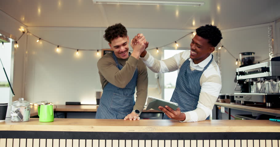 Men, barista and tablet with high five for congratulations, social media and trailer cafe teamwork. People, tech and waiter for customer service, partnership or mobile coffee shop review for success
