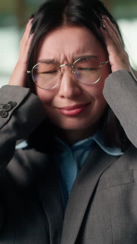Stress work problem annoyed Asian Chinese Korean business woman holding head pain headache overworked sorrow emotion Japanese girl businesswoman industrial worker depression suffer migraine in office