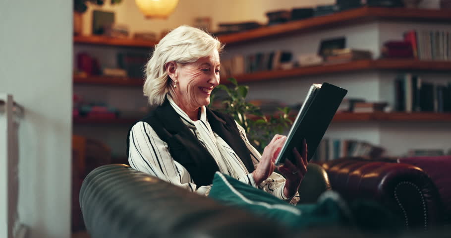 Browsing, info and mature woman with tablet in office, publisher or proofreading of novel on website. Scroll, ebook and plan for launch in publishing agency, creative and person with tech for editing