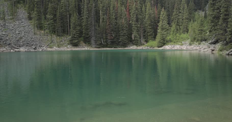 Mirror Lake on the hiking trail up to Lake Agnes Tea House on Mount St. Piran and Mount Whyte, within Banff National Park near Lake Louise Alberta.