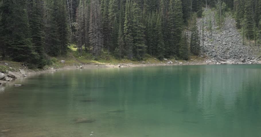 Mirror Lake on the hiking trail up to Lake Agnes Tea House on Mount St. Piran and Mount Whyte, within Banff National Park near Lake Louise Alberta.