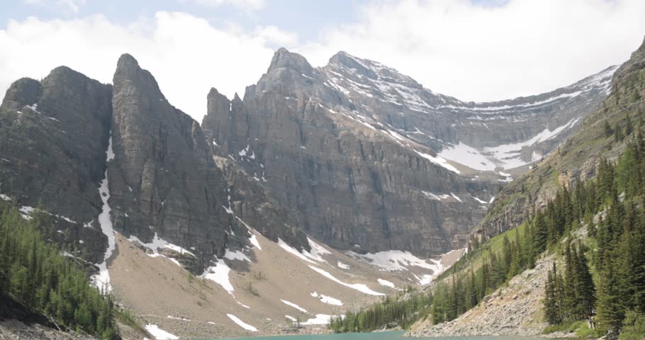 Beautiful view lake Agnes and a mountain range in the background from the Lake Agnes Tea House on Mount St. Piran and Mount Whyte, within Banff National Park near Lake Louise Alberta.