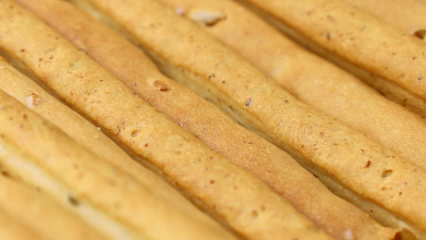 Traditional Italian breadsticks grissini circle rotation close up