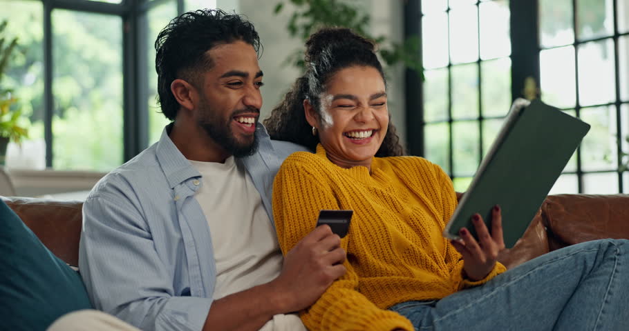 Couple, tablet and credit card on sofa with online shopping, laugh and easy payment in lounge at house. People, happy man and woman with fintech app, ecommerce or discount sale on couch at apartment