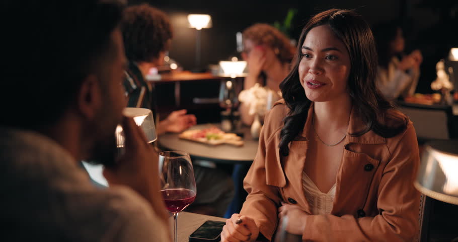 Conversation, date and laughing with couple in restaurant at night for bonding or celebration. Fine dining, funny and love with people at table together for anniversary, cuisine or relationship chat