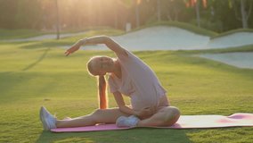 Pregnant woman exercising in a green field at sunrise. Healthy pregnancy, prenatal fitness, outdoor workout and wellness lifestyle concept for maternity programs, blogs and health ads. Slowmotion - Powered by Shutterstock - Get 15% off with code: PIKWIZARD15