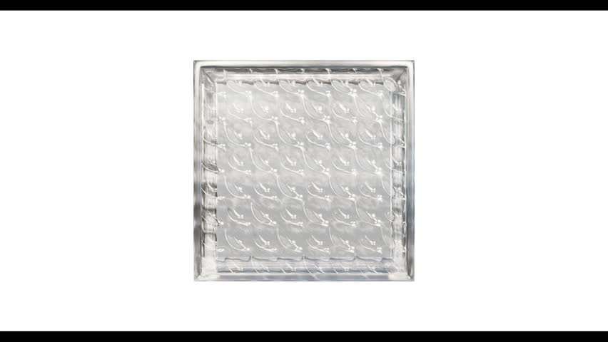 Transparent glass block for interior design rotating on a white background. Aesthetic and modern shape of the oject.  Building assortment for home, bathroom and office. 3D render animation