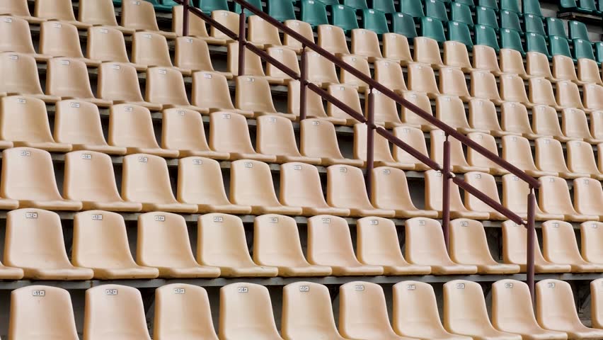 Empty green and white stadium seats. Empty stadium or race track seats