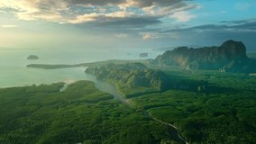 Golden hour aerial of Krabi s lush mangroves, winding rivers, and limestone cliffs leading to the sea. Ideal for cinematic travel promos, eco-tourism visuals, or nature branding. - Powered by Shutterstock - Get 15% off with code: PIKWIZARD15
