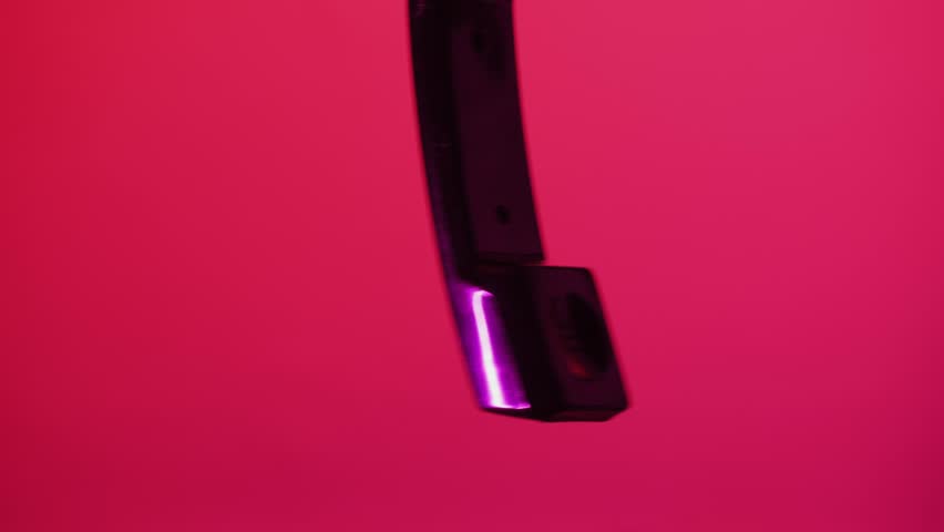 Red retro vintage phone telephone ringing off on table, close up macro 90s mobile retro smartphone.