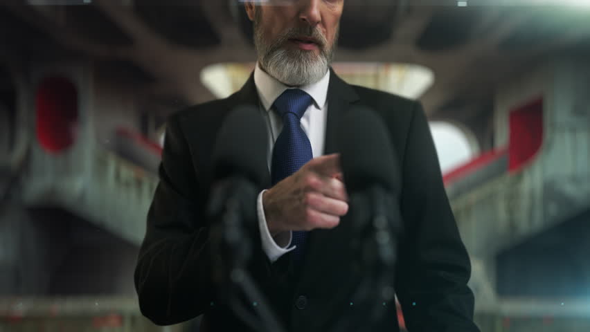 Displeased male government official speaks angrily on palace hall background