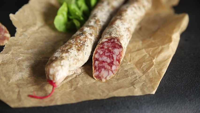 Sausage dry-cured pork meat smoked food fresh gourmet food background on the table rustic food top view copy space