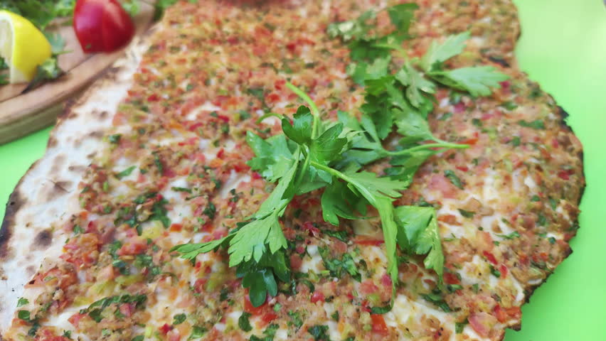 Traditional Turkish Cuisine Flavor Lahmacun Serving Preparation with Parsley Footage.