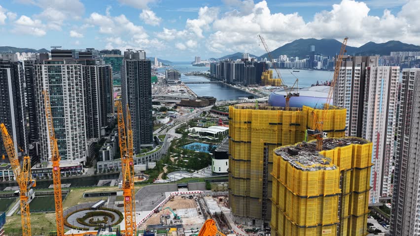 Hong Kong Kai Tak Sports Park includes a world-class multi-purpose main venue with retractable canopy and coastal dining area by seaside Victoria Harbour connected Station Metropolitan Park