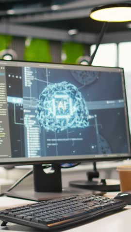 Vertical video Advanced AI algorithms running on computer monitors in empty startup workspace deploying machine learning models. Artificial intelligence coding platform on PC screens in modern office