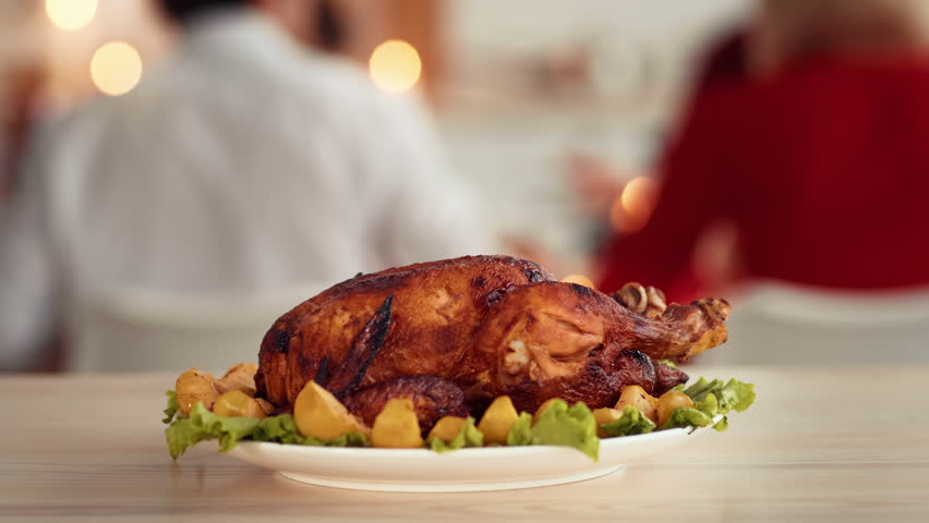 Thanksgiving Day feast with roasted turkey and festive atmosphere