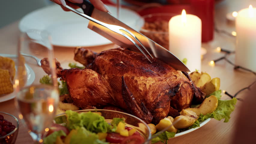 Gathering around a festive Thanksgiving dinner with a beautifully roasted turkey