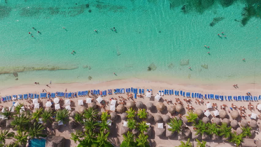 Aerial footage captures Cozumels stunning beautypristine beaches, turquoise waters, and vibrant activities make it the ultimate tropical paradise getaway youve always dreamed of