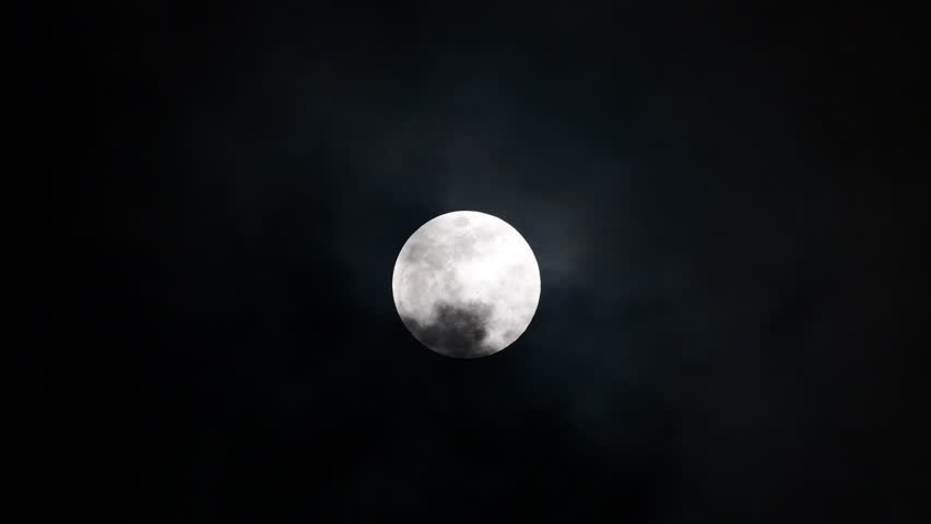 Moment of cloud through moon in the night. real time.