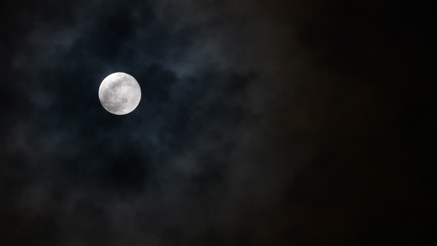 Moment of cloud through moon in the night. real time.