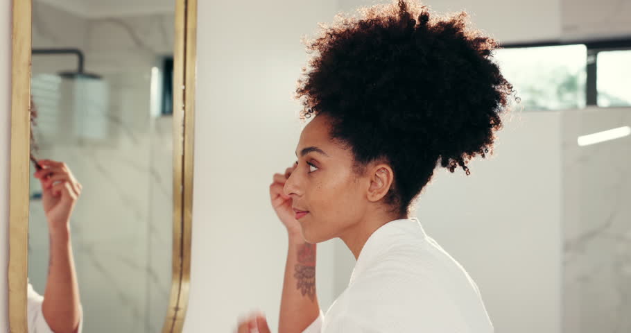 Mirror, bathroom and black woman in home for hair care, grooming or wellness for morning routine. Happy, beauty or person in reflection with natural style for getting ready, afro texture or treatment