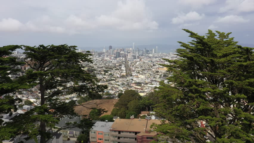 San Francisco Overview From Twin Peaks With Dense Urban Housing And Downtown Skyscrapers In Distance. drone shot