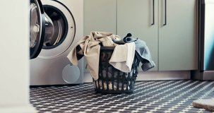 Laundry, washing machine and basket with clothes in home for maintenance, housework or hygiene. Empty, apartment and container with textiles, fabric and material for housekeeping, cleaning or chores - Powered by Shutterstock - Get 15% off with code: PIKWIZARD15