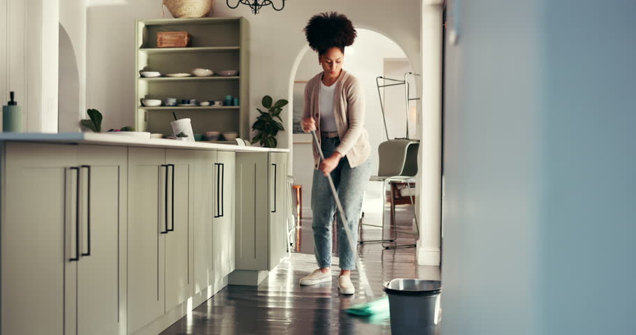 Dance, cleaning and woman with mop in home for dust, hygiene and floor maintenance for chores. Apartment, sanitation and African person with music for housekeeping, housework and dirt prevention