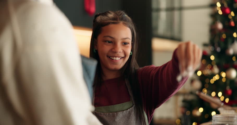 Christmas baking, parent and child with flour in kitchen for festive dessert, help and celebration. Holiday season, people and preparation process in home for xmas biscuits, learning and cake recipe