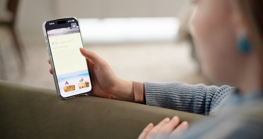 Hands, phone screen and vacation destination with person in living room of home for reservation. Holiday booking, search and scrolling with woman in apartment for tourism website or travel options