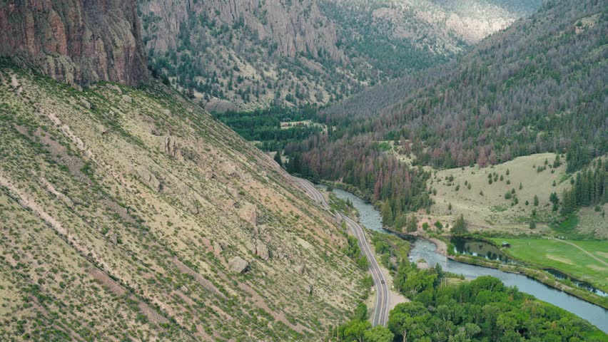 Slow aerial reveal of the Rio Grande through the wagon wheel gap in Creede Colorado.