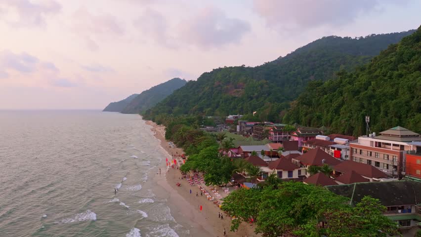 Sunset aerial of White Sand Beach with people strolling by the sea,Koh Chang
