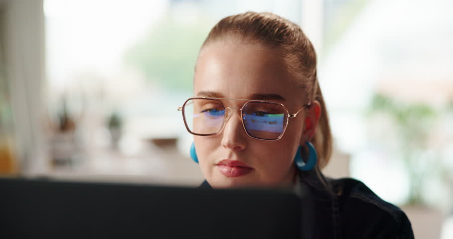 Computer reflection, reading and business woman in office for editing, copywriting and research. Technology, worker and check website online for creative problem solving or content writing at startup