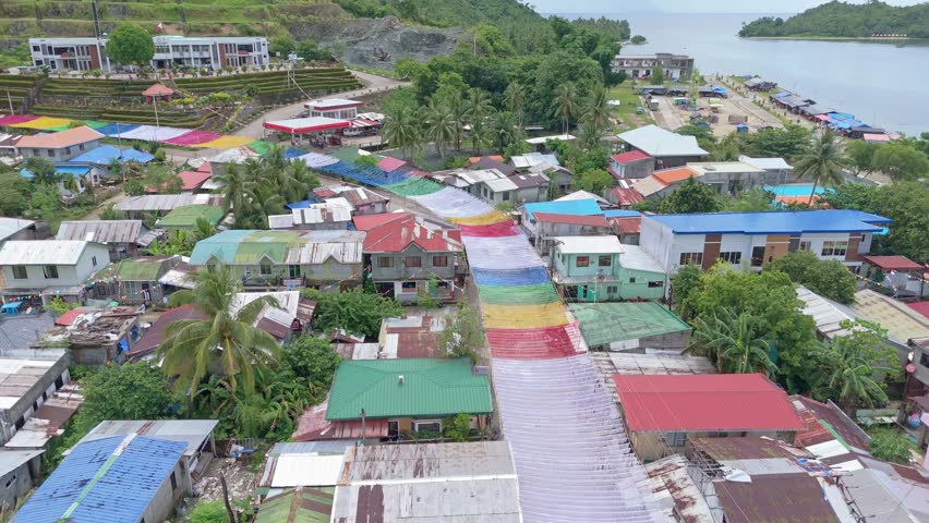 Cagdianao village on Dinagat Island prepares for Fiesta, showcasing vibrant colorful roofs