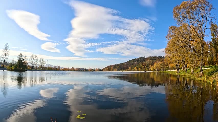 Sunny autumn day on the lake, slow motion
