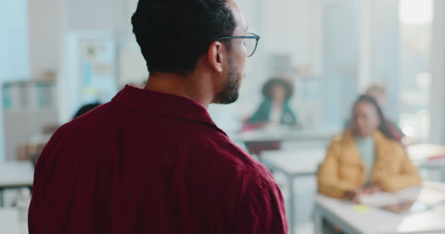 Man, lecturer and explain in classroom for lesson, college lecture and teaching students. Male professor, talking and learners listen for learning schedule, curriculum procedure and exam instructions