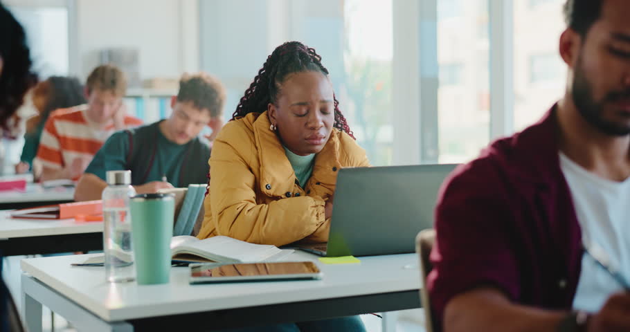 Sick woman, student and nap with stress in classroom for anxiety, illness or nausea at university. Tired, female person or virus with fatigue, depression or rest on table for burnout or pressure