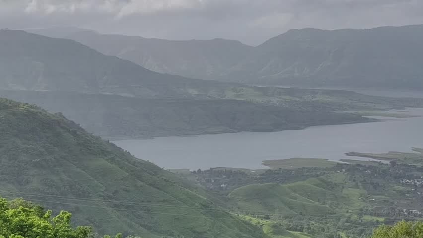 Majestic hills and a calm lake stretch across the horizon — nature at its finest in the peaceful landscapes of Panchgani-Mahabaleshwar.