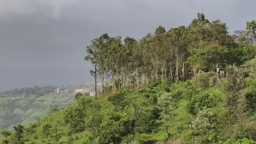 Breathtaking panoramic view of lush green hills and serene lake from Panchgani-Mahabaleshwar, a popular monsoon getaway in the Western Ghats of Maharashtra.