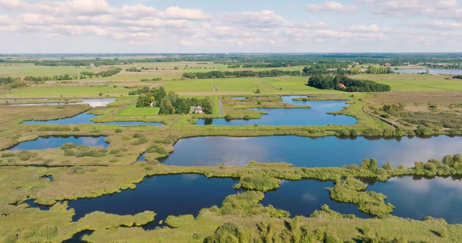 Aerial 5K view of lakes in De Alde Feanen, Earnewald, Friesland, Netherlands