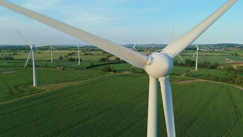 Green Energy Wind Farm in English Fields Shot by Drone at Golden Hour