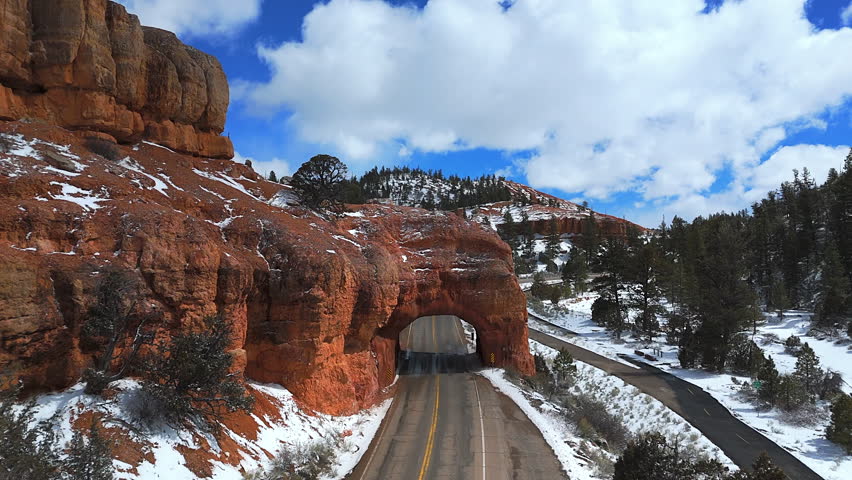 Famous Red Canyon Tunnel Near Bryce Canyon National Park In Utah, United States. Aerial Drone Shot