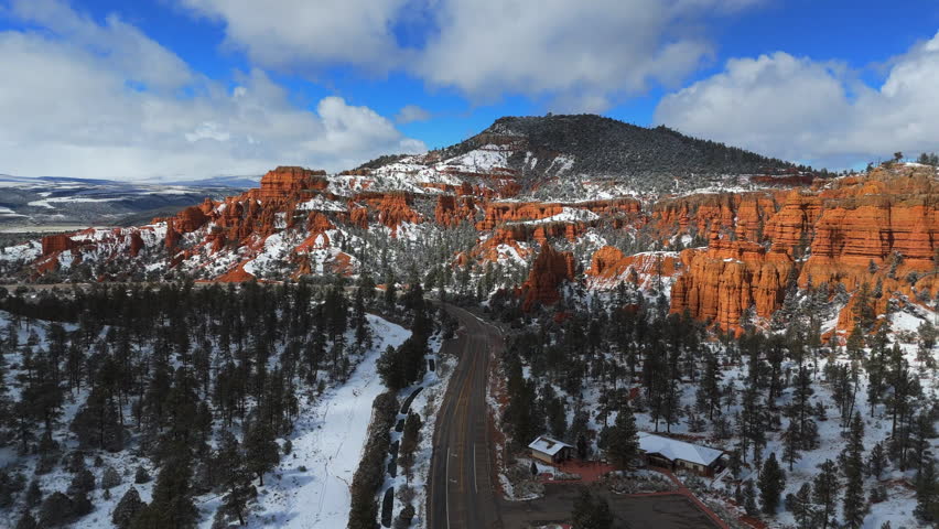 Road Within The Bryce Canyon National Park With Red Canyons, Snow-covered Forest And Hoodoos In Utah, USA. - aerial shot